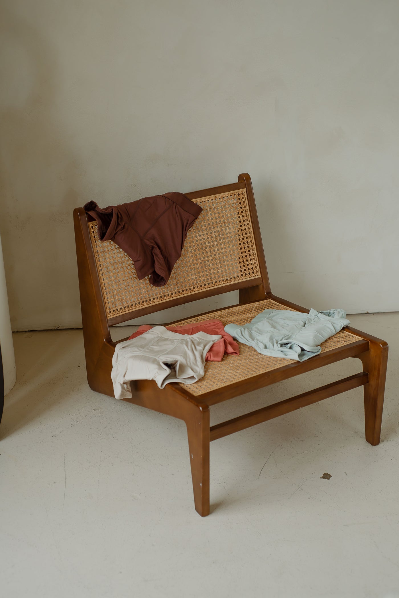 Revol Cares period underwear on a wicker chair